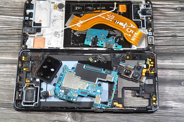 Mobile phone repair tools and disassembled Samsung Galaxy components